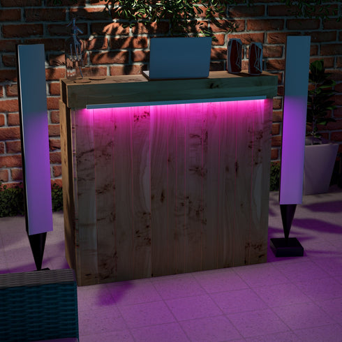 Wooden bar with pink LED lighting against a brick wall