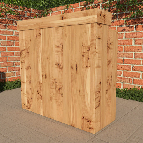 Wooden planter box against a brick wall