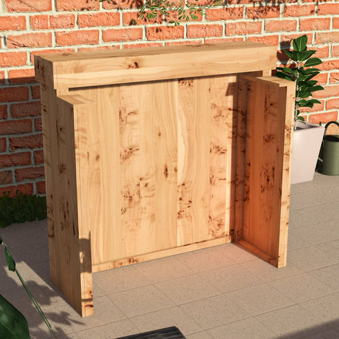 Wooden outdoor furniture piece against a brick wall