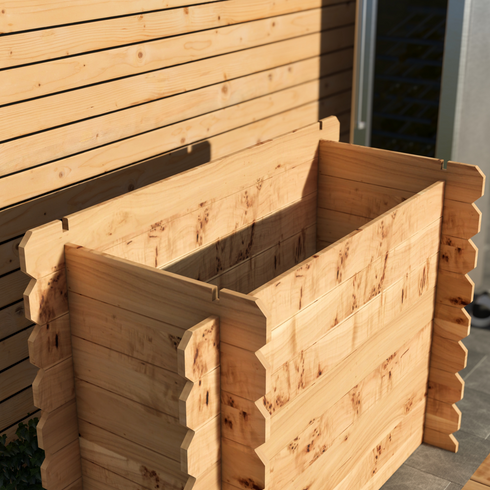 Wooden planter box against a wooden wall