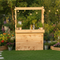 Wooden garden bar with plants and bottles in a garden setting