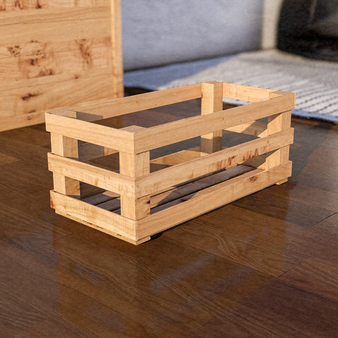 Wooden crate on a wooden floor with a blurred background