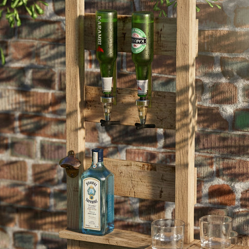 Alcohol bottles on a wooden stand against a brick wall