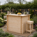 Wooden outdoor bar set with drinks and snacks in a garden setting