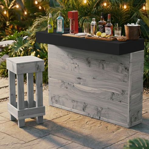 Outdoor bar setup with drinks and a stool on a patio