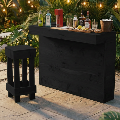 Black outdoor bar with drinks and a stool on a patio