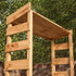 Wooden gardem bar with a roof and shelves against a green leafy background