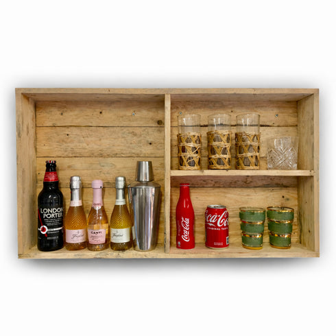 Wooden shelf with various bottles and glasses on a white background