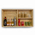 Wooden shelf with various bottles and glasses on a white background