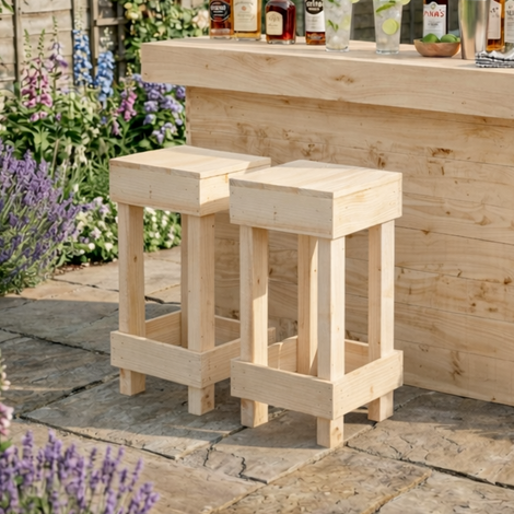 Wooden outdoor bar set with stools in a garden setting